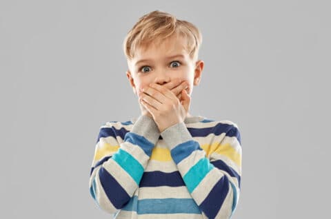 Boy Covering Mouth